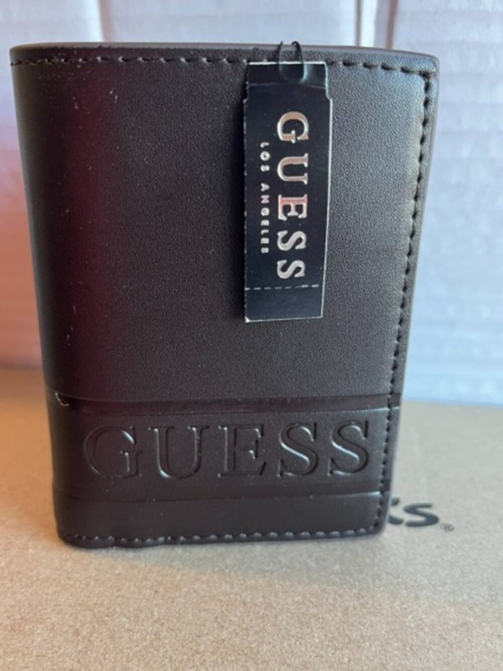 Guess Los Angeles men’s trifold wallet.